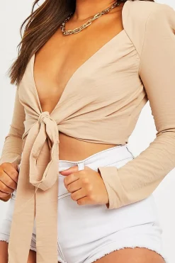 Rebellious Fashion Beige Shoulder Pad Wrap Around Crop Top - Jadora