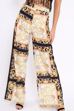 Rebellious Fashion Black and Gold Scarf Print High Waist Flare Trousers - Freddy