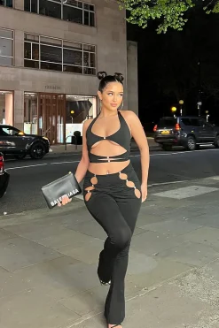Rebellious Fashion Black Cut Out Halter Neck Crop Top & Flare Trouser Set - Ariel