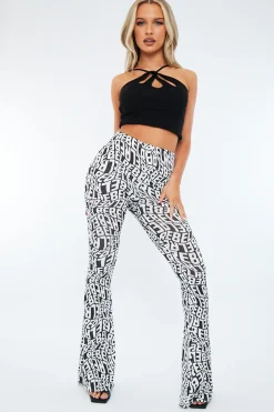 Rebellious Fashion Black White Rebel Print Flare Trousers - Indy