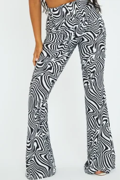 Rebellious Fashion Black White Wave Print Slinky Flare Trousers - Ila