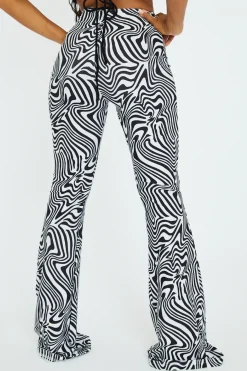 Rebellious Fashion Black White Wave Print Slinky Flare Trousers - Ila