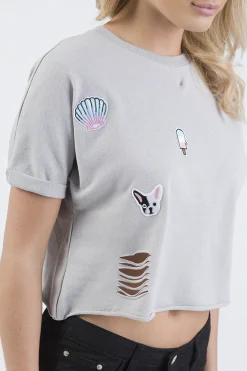 Rebellious Fashion Grey Distressed Badge Detail Crop Top - Toni