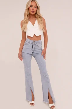 Rebellious Fashion Light Blue Front Slit Flared Leg Jeans - Macie