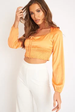 Rebellious Fashion Orange Shirred Long Sleeve Strap Back Detail Crop Top -Traniyah