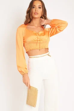 Rebellious Fashion Orange Shirred Long Sleeve Strap Back Detail Crop Top -Traniyah