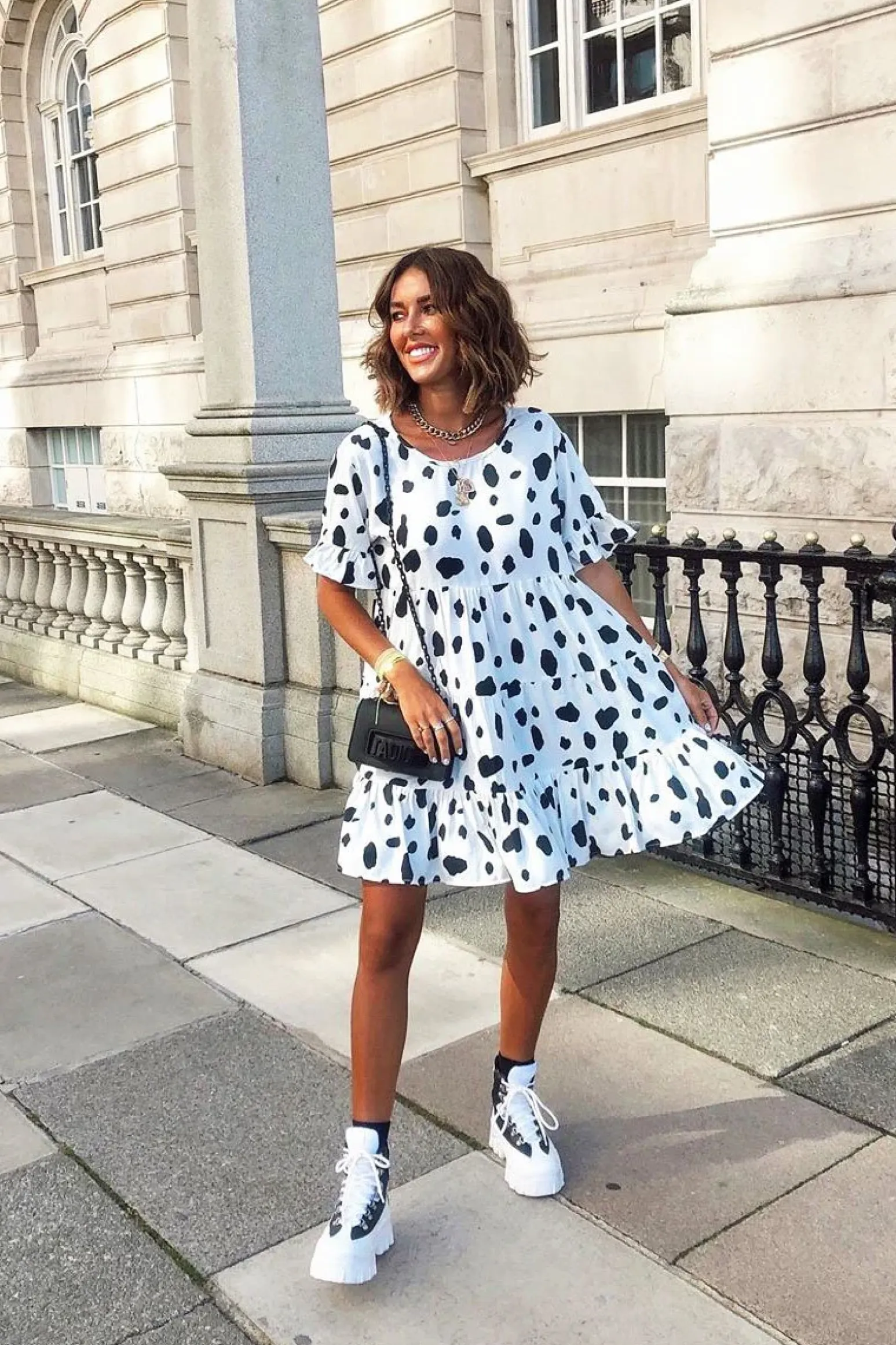 Rebellious Fashion White Black Cow Print Tiered Smock Dress - Makensi