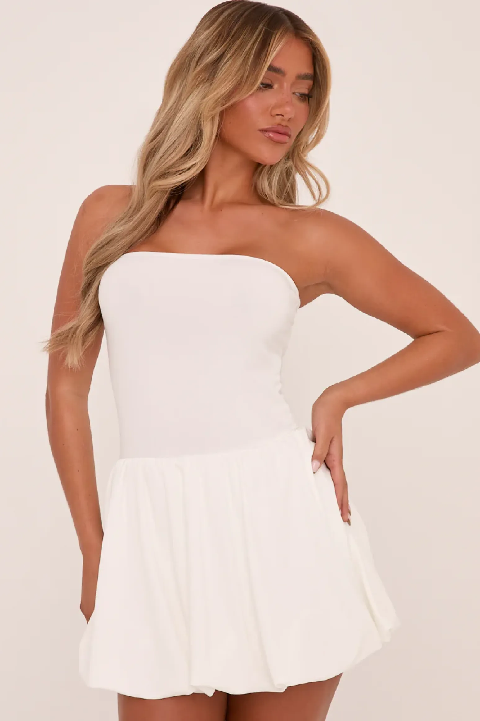 Rebellious Fashion White Bandeau Drop Waist Puffball Detail Mini Dress - Saffiya