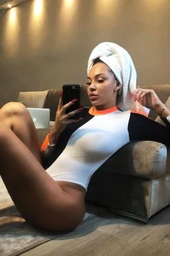 Rebellious Fashion White Black and Neon Orange Contrast Long Sleeved Bodysuit - Lareen