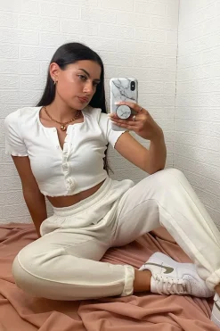 Rebellious Fashion White Ribbed ButtonFrill Hem Crop Top - Pennie